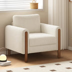 Poltrona decorativa imbottita in velluto Teddy con gambe in noce